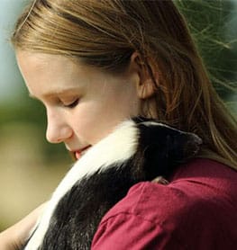 Girl holding a Skunk